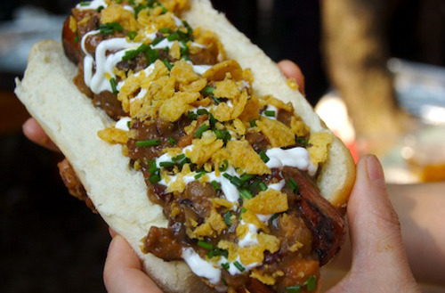 Loosiana Gator Dog A butterflied Wagyu beef frank stuffed with a melted 3-cheese blend, topped with a tequila-spiked three-bean alligator chili and finished off with sour cream, freshly chopped chives, and crushed Fritos. (submitted by gonzo via shamelesscarnivore)